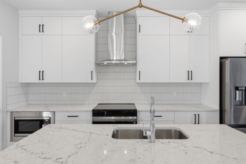 151 Ellen Road, Crossfield, AB - Indoor Photo Showing Kitchen With Double Sink With Upgraded Kitchen