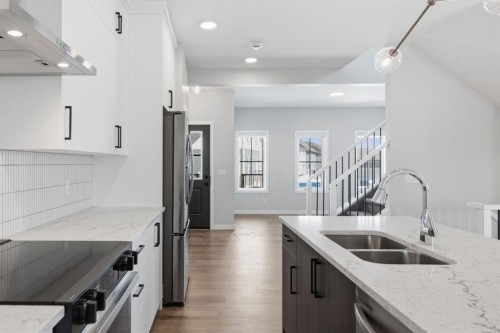151 Ellen Road, Crossfield, AB - Indoor Photo Showing Kitchen With Double Sink With Upgraded Kitchen