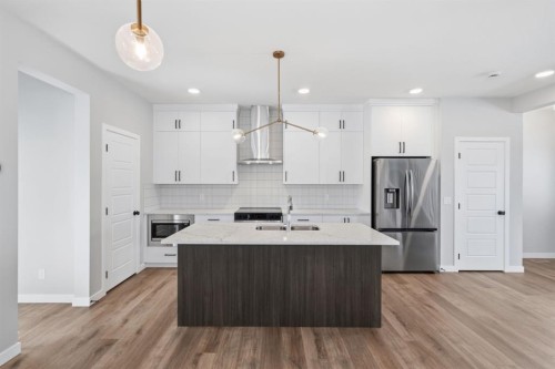 151 Ellen Road, Crossfield, AB - Indoor Photo Showing Kitchen With Double Sink With Upgraded Kitchen