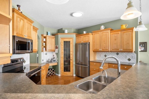 35 Lake Ridge, Olds, AB - Indoor Photo Showing Kitchen With Double Sink
