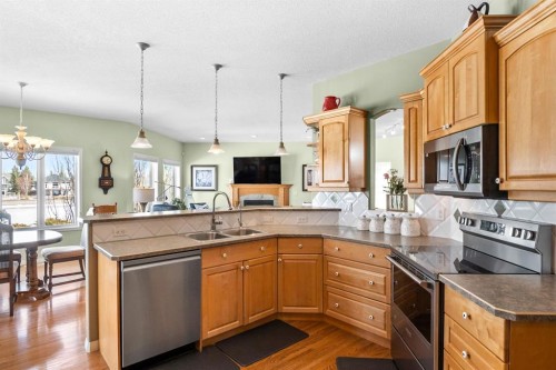 35 Lake Ridge, Olds, AB - Indoor Photo Showing Kitchen With Double Sink