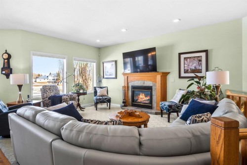 35 Lake Ridge, Olds, AB - Indoor Photo Showing Living Room With Fireplace