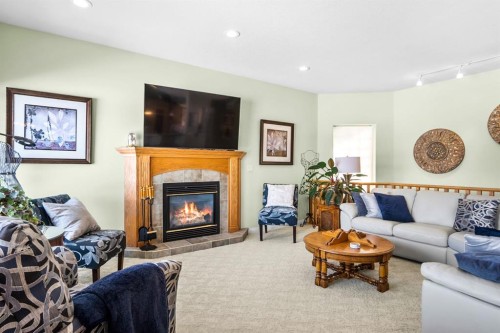 35 Lake Ridge, Olds, AB - Indoor Photo Showing Living Room With Fireplace