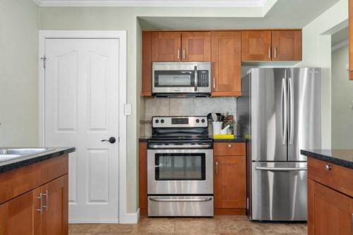 6112 Buckthorn Road Nw, Calgary, AB - Indoor Photo Showing Kitchen With Stainless Steel Kitchen