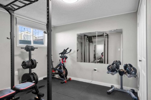 6112 Buckthorn Road Nw, Calgary, AB - Indoor Photo Showing Gym Room