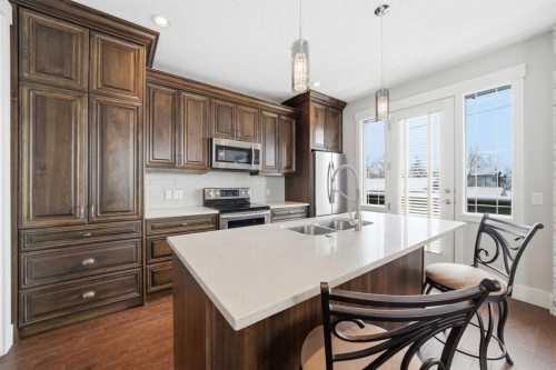 201 12 Street Ne, Calgary, AB - Indoor Photo Showing Kitchen With Stainless Steel Kitchen With Double Sink With Upgraded Kitchen