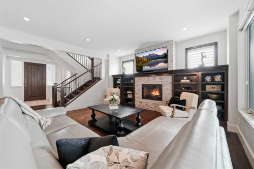 201 12 Street Ne, Calgary, AB - Indoor Photo Showing Living Room With Fireplace