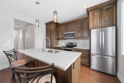 201 12 Street Ne, Calgary, AB - Indoor Photo Showing Kitchen With Stainless Steel Kitchen With Double Sink With Upgraded Kitchen