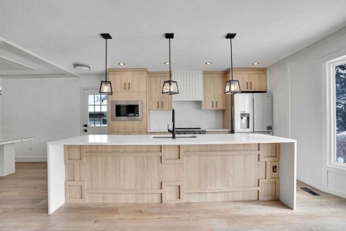 908 Stonehaven Road Sw, Calgary, AB - Indoor Photo Showing Kitchen With Upgraded Kitchen