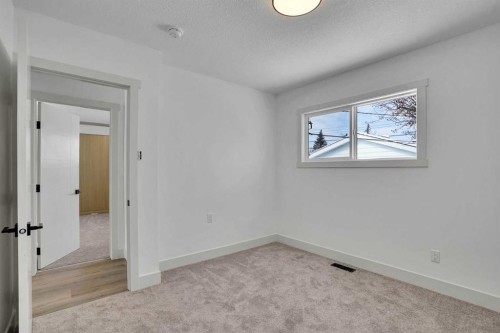 908 Stonehaven Road Sw, Calgary, AB - Indoor Photo Showing Other Room