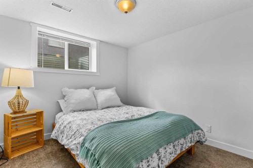 9963 Wilde Road Se, Calgary, AB - Indoor Photo Showing Bedroom