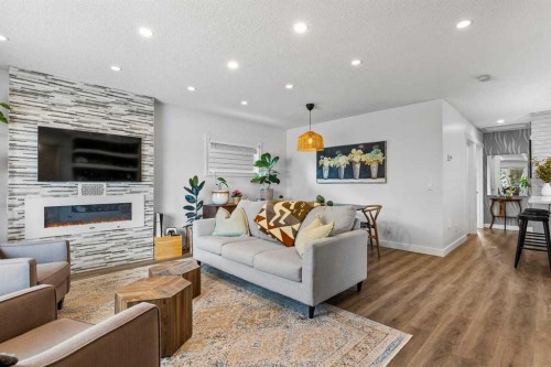 9963 Wilde Road Se, Calgary, AB - Indoor Photo Showing Living Room With Fireplace