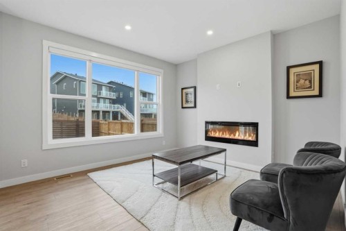 61 Calhoun Crescent Ne, Calgary, AB - Indoor Photo Showing Living Room With Fireplace