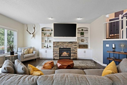 739 Cimarron Close, Okotoks, AB - Indoor Photo Showing Living Room With Fireplace