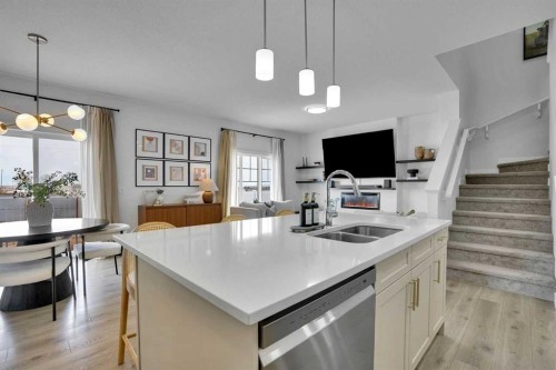 58 Ranchers View, Okotoks, AB - Indoor Photo Showing Kitchen With Double Sink