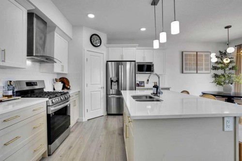 58 Ranchers View, Okotoks, AB - Indoor Photo Showing Kitchen With Double Sink With Upgraded Kitchen