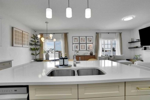 58 Ranchers View, Okotoks, AB - Indoor Photo Showing Kitchen With Double Sink