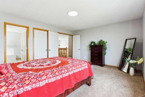 292 Taracove Estate Drive Ne, Calgary, AB - Indoor Photo Showing Bedroom