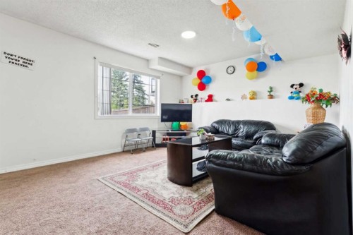 292 Taracove Estate Drive Ne, Calgary, AB - Indoor Photo Showing Living Room