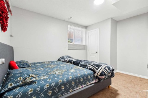 292 Taracove Estate Drive Ne, Calgary, AB - Indoor Photo Showing Bedroom