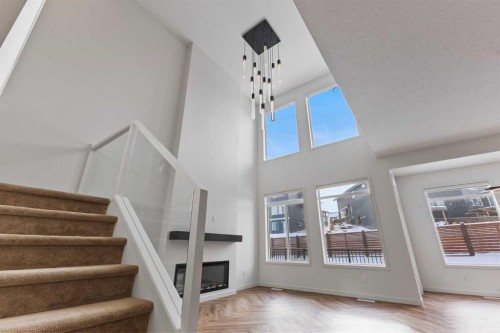 229 Calhoun Crescent Ne, Calgary, AB - Indoor Photo Showing Other Room With Fireplace