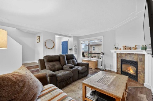 42F Green Meadow Crescent, Strathmore, AB - Indoor Photo Showing Living Room With Fireplace