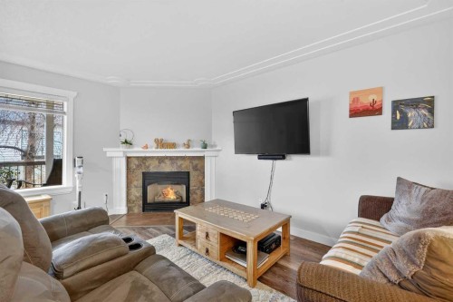 42F Green Meadow Crescent, Strathmore, AB - Indoor Photo Showing Living Room With Fireplace