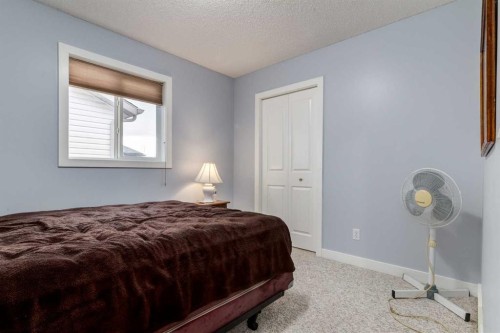 216 Silverado Range Close Sw, Calgary, AB - Indoor Photo Showing Bedroom