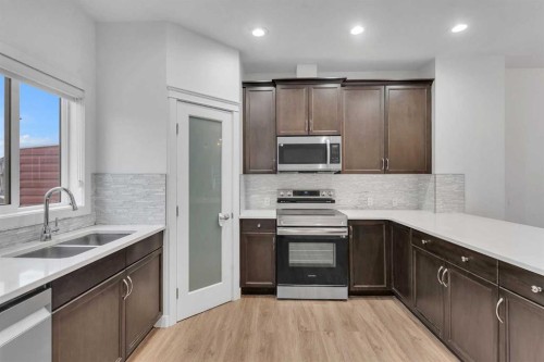 9 Redstone Common Ne, Calgary, AB - Indoor Photo Showing Kitchen With Double Sink With Upgraded Kitchen