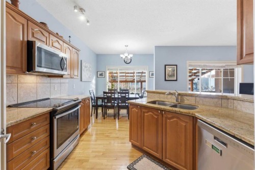 129 Cougartown Circle Sw, Calgary, AB - Indoor Photo Showing Kitchen With Stainless Steel Kitchen With Double Sink