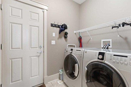 129 Cougartown Circle Sw, Calgary, AB - Indoor Photo Showing Laundry Room