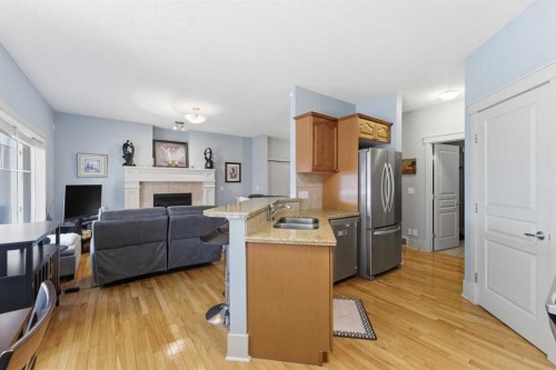 129 Cougartown Circle Sw, Calgary, AB - Indoor Photo Showing Kitchen With Stainless Steel Kitchen With Double Sink