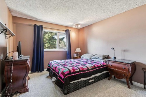 443 Brookmere Crescent Sw, Calgary, AB - Indoor Photo Showing Bedroom