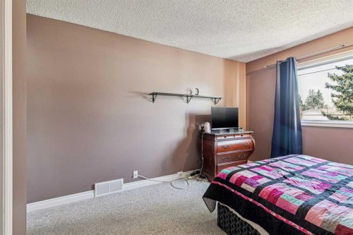 443 Brookmere Crescent Sw, Calgary, AB - Indoor Photo Showing Bedroom