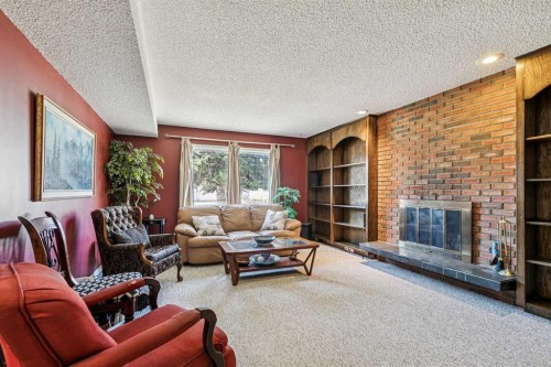 443 Brookmere Crescent Sw, Calgary, AB - Indoor Photo Showing Living Room With Fireplace
