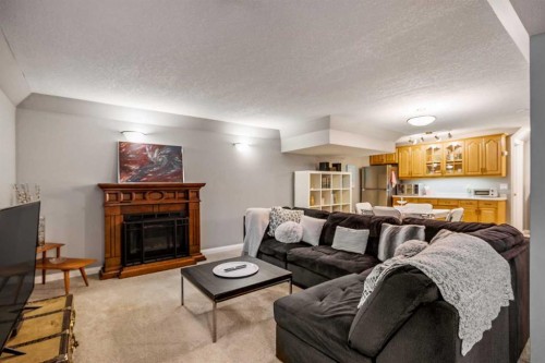 224 Cedarbrae Crescent Sw, Calgary, AB - Indoor Photo Showing Living Room With Fireplace