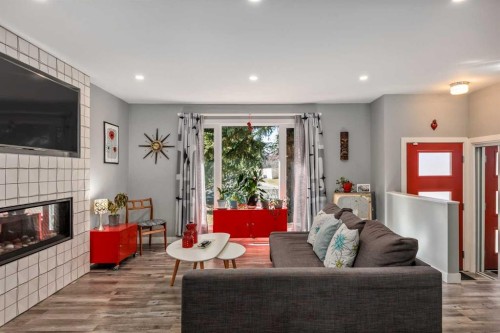 224 Cedarbrae Crescent Sw, Calgary, AB - Indoor Photo Showing Living Room With Fireplace
