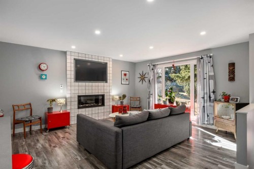 224 Cedarbrae Crescent Sw, Calgary, AB - Indoor Photo Showing Living Room With Fireplace