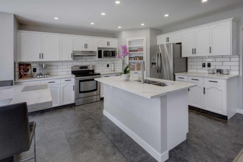 42 Evansbrooke Way Nw, Calgary, AB - Indoor Photo Showing Kitchen With Double Sink With Upgraded Kitchen