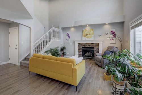 42 Evansbrooke Way Nw, Calgary, AB - Indoor Photo Showing Living Room With Fireplace