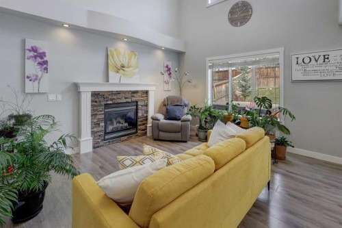42 Evansbrooke Way Nw, Calgary, AB - Indoor Photo Showing Living Room With Fireplace