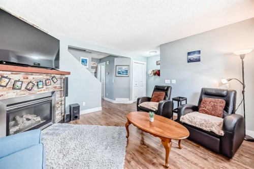 57 Martinvalley Way Ne, Calgary, AB - Indoor Photo Showing Living Room With Fireplace