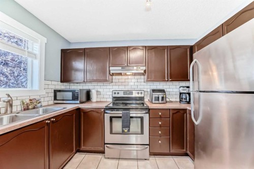 57 Martinvalley Way Ne, Calgary, AB - Indoor Photo Showing Kitchen With Stainless Steel Kitchen With Double Sink