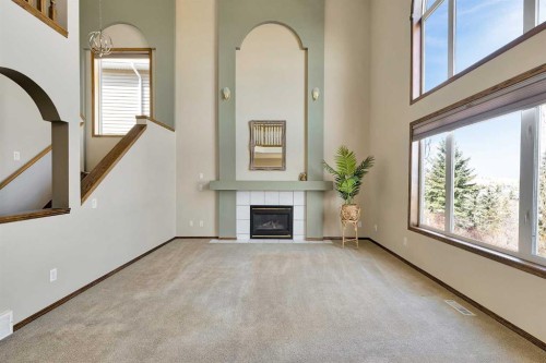 271 Edgebrook Park Nw, Calgary, AB - Indoor Photo Showing Other Room With Fireplace