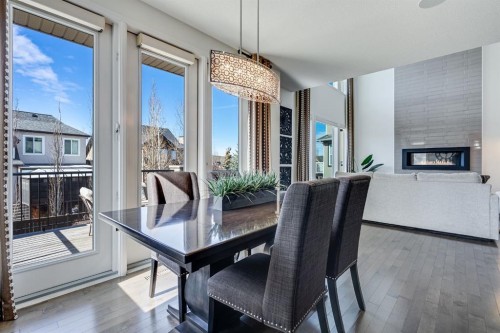 117 Mahogany Place Se, Calgary, AB - Indoor Photo Showing Dining Room With Fireplace