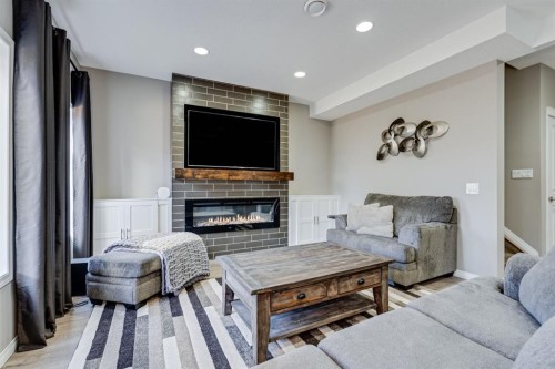 117 Mahogany Place Se, Calgary, AB - Indoor Photo Showing Living Room With Fireplace