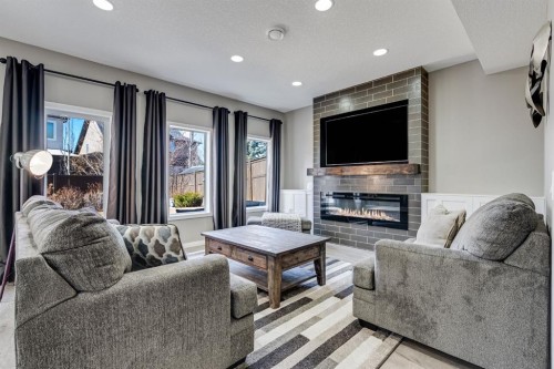 117 Mahogany Place Se, Calgary, AB - Indoor Photo Showing Living Room With Fireplace