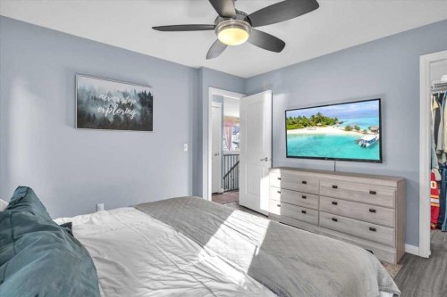 301 Mcleod Crescent, Diamond Valley, AB - Indoor Photo Showing Bedroom