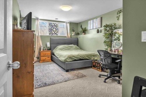 301 Mcleod Crescent, Diamond Valley, AB - Indoor Photo Showing Bedroom