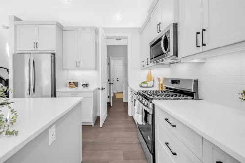 55 Amblehurst Link Nw, Calgary, AB - Indoor Photo Showing Kitchen With Upgraded Kitchen